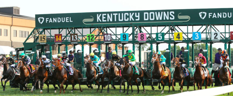 Horses spring from the gate at Kentucky Downs